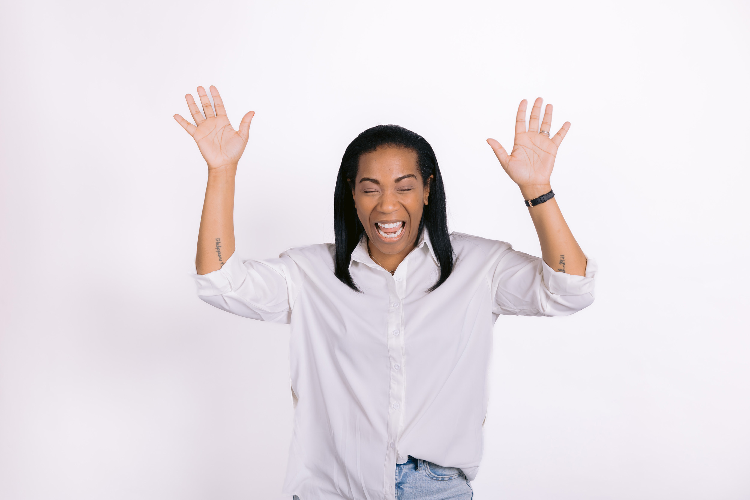 Headshot of woman celebrating with hands up, for Beauty Boost Biz 2024.
