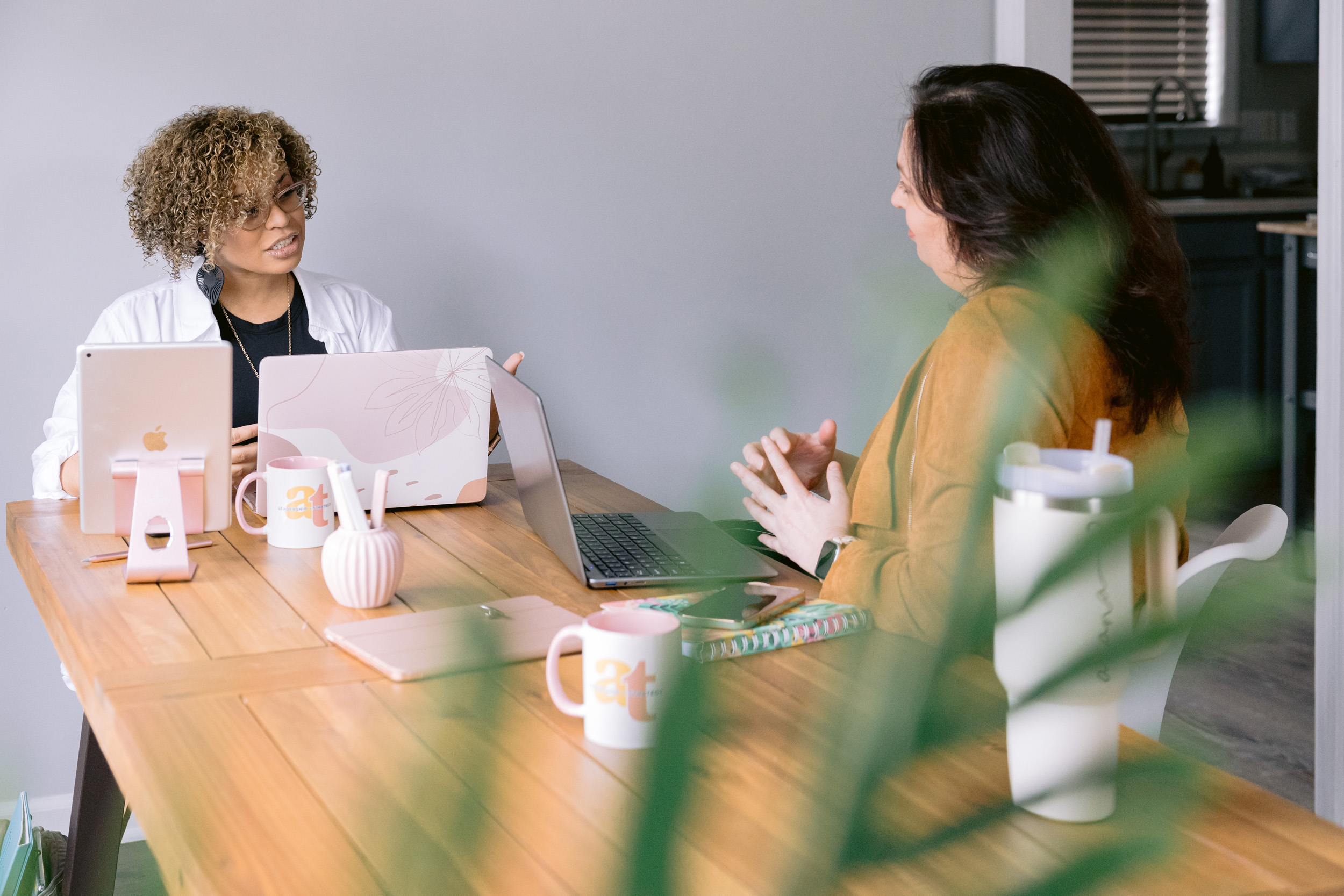 Ariana Tenine works with a client at her desk