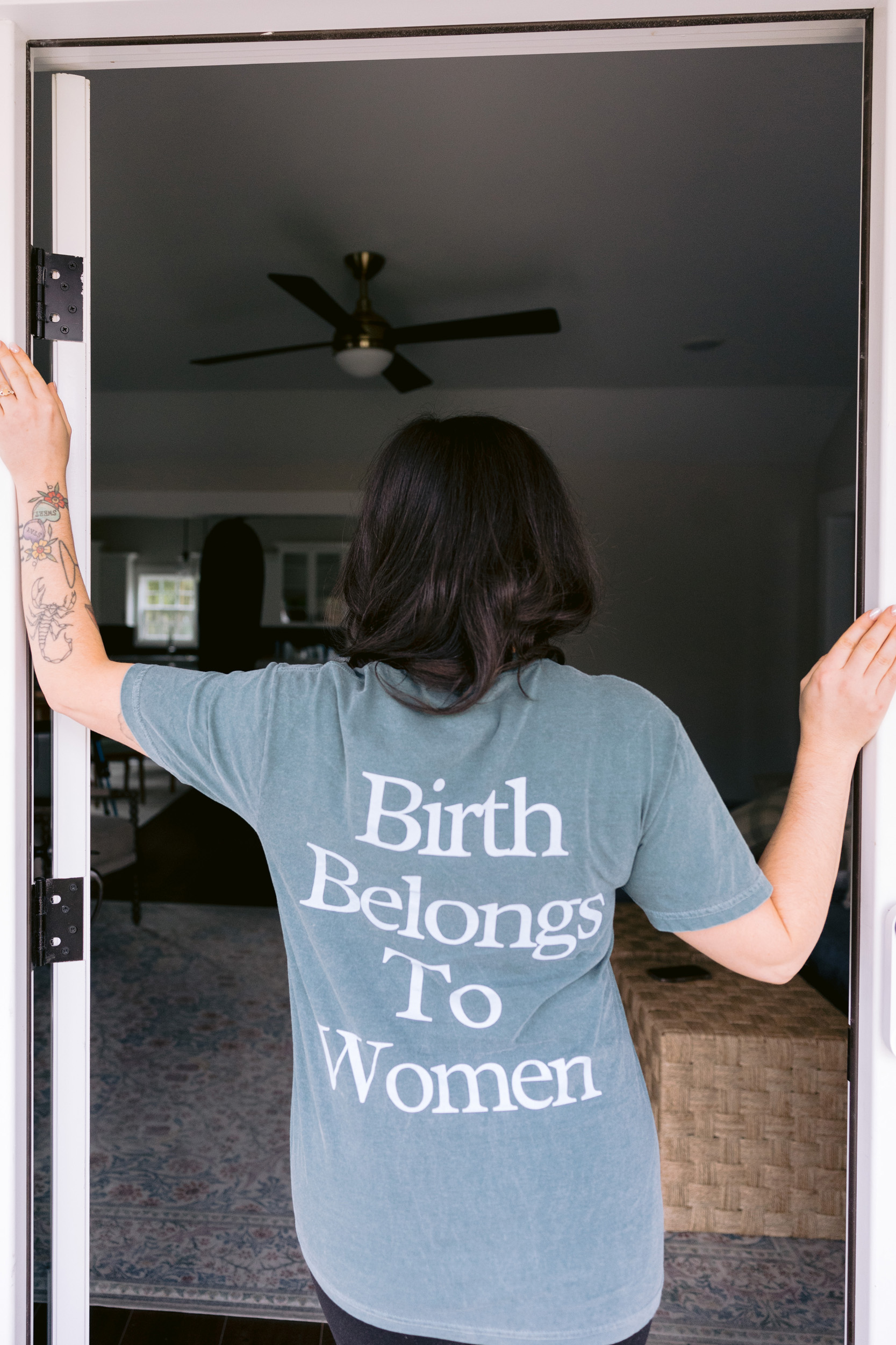 T-shirt featuring the phrase "Birth Belongs to Women," photographed by Mabyn Ludke Photography.