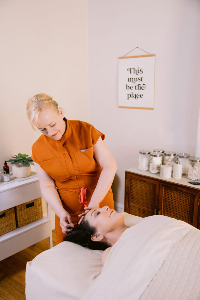  A woman enjoys a soothing massage in a tranquil room, part of Lisa Cordia Holistic Therapies. Photo by Mabyn Ludke.